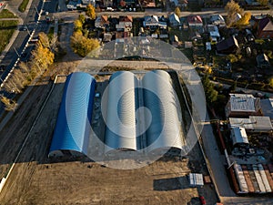 Aerial view of the six round cylindrical storage hangars on a br