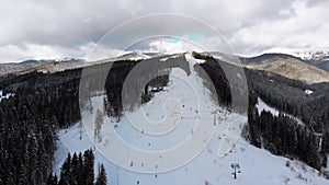 Aerial view on Ski Slopes with Skiers and Ski Lifts on Ski Resort in Winter