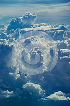 Aerial view through sky above the clouds abstract background.