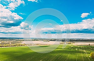 Aerial View. Sky With Clouds Above Countryside Rural Field Landscape In Spring Summer Cloudy Day. Scenic Sky With Fluffy