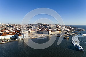 Aerial view of the skyline of the city of Lisbon with the Comercio Square, the Alfama Neighbourhood and the Tagus River