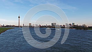 Aerial view of the Skyline of Duesseldorf while flying over the river Rhine - Germany - Europe