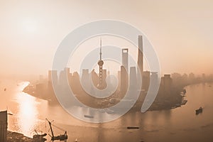 Aerial view of skyscraper and high-rise office buildings in Shanghai Downtown with fog, China. Financial district and business