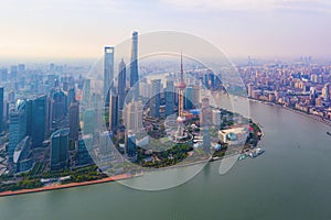 Aerial view of skyscraper and high-rise office buildings in Shanghai Downtown with Huangpu River, China. Financial district and