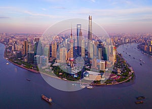 Aerial view of skyscraper and high-rise office buildings in Shanghai Downtown with Huangpu River, China. Financial district and