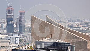 Aerial view of skyscraper rooftop and Bur Dubai, the Creek, Deira district and Sharjah timelapse