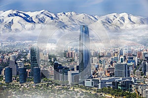 Aerial view on skyscrapers of Financial District of Santiago, capital of Chile under early morning fog