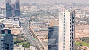 Aerial view of skyscrapers under construction in Dubai timelapse.