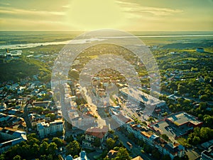 Aerial view of Slatina city at sunset, Romania. Drone flight over the european city at sunset