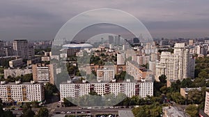 Aerial view of the sleeping district of Moscow against the background of the business center and the Dynamo stadium