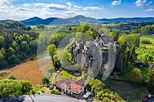 Aerial view of Sloup Castle in Northern Bohemia, Czechia. Sloup rock castle in the small town of Sloup v Cechach, in the Liberec