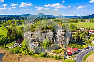 Aerial view of Sloup Castle in Northern Bohemia, Czechia. Sloup rock castle in the small town of Sloup v Cechach, in the Liberec