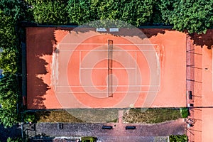 Aerial view of a smal local Tennis courts for recreation and tennis training. Sporting area outdoors seen from above