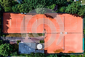 Aerial view of a smal local Tennis courts for recreation and tennis training. Sporting area outdoors seen from above