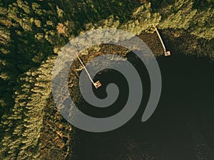 Aerial view of a smal wooden dock on a lake.