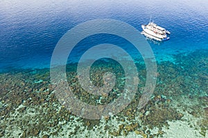 Aerial View of Small Boat and Coral Reef in Papua New Guinea