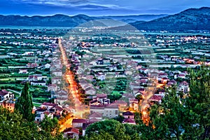Aerial view of a small Croatian town in night with bright lights