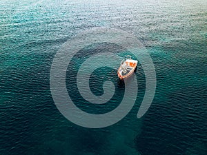 Aerial view of small fishing boat at sea, Greece