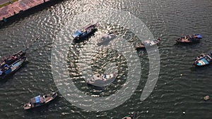 Aerial view of small fishing boats docked in Han river port in Da Nang Vietnam.