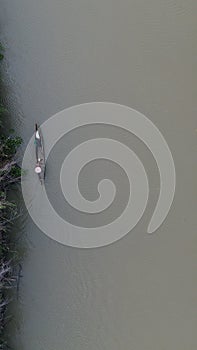 Aerial View of Small Fishing Boats Floating on the River in the Forest