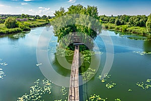 Aerial view, a small fishing house in the middle of the river on the island, Ukraine, summer, clear sunny weather.Concept, travel