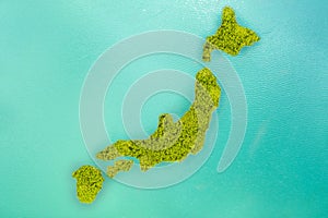 Aerial view small green island that shape looks like Japan