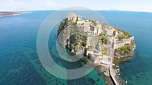 Aerial view of small island with ancient Aragonese Castle in Ischia, tourism