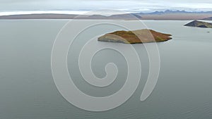 Aerial view of a small island in a fjor in Iceland.