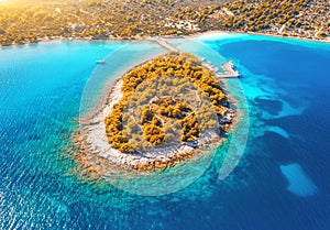 Aerial view of small island in sea bay at sunset in autumn