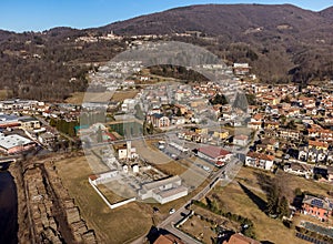 Aerial view of small Italian village Grantola with cemetery and ancient church of San Pietro, province of Varese, Italy