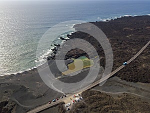 Aerial view of the small lake under the mountain Bermeja, Lanzarote, Canary Islands, Spain