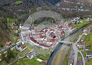 Aerial view of the small medieval town St-Ursanne on River Doubs under Jura Mountain