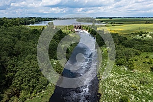 Aerial view of a small old dam on the river