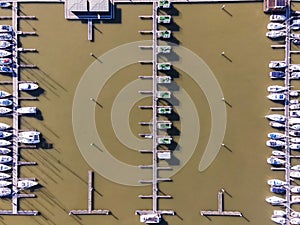 Aerial view of a small pier with speedboats and sailing boats docket at Marina harbour in Lisbon downtown, Oriente, Lisbbon,