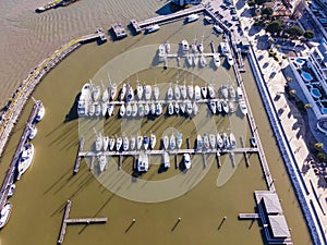 Aerial view of a small pier with speedboats and sailing boats docket at Marina harbour in Lisbon downtown, Oriente, Lisbbon,