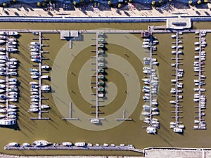 Aerial view of a small pier with speedboats and sailing boats docket at Marina harbour in Lisbon downtown, Oriente, Lisbbon,