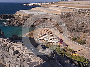 Aerial view of a small protected bay with golden sand Abama beach of Ritz Carlton Abama luxury hotel. Adeje coast