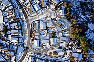 Aerial view of small residential streets covered in snow during winter