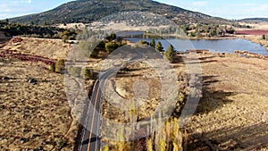 Aerial view of small road with car next the Lake Cuyamaca, California, USA