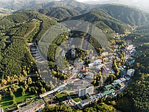 Aerial view of a small town in the Altai territory. Top view of the resort town Belokurikha. Bird`s-eye view of the houses among