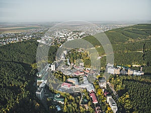 Aerial view of a small town in the Altai territory. Top view of the resort town Belokurikha. Bird`s-eye view of the houses among