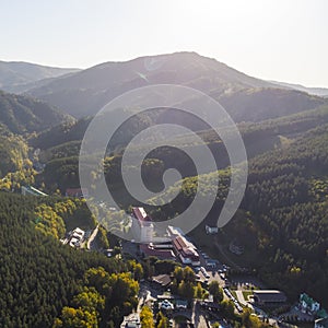 Aerial view of a small town in the Altai territory. Top view of the resort town Belokurikha. Bird\'s-eye view of the houses among