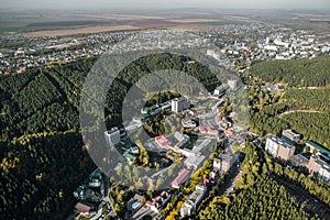 Aerial view of a small town in the Altai territory. Top view of the resort town Belokurikha. Bird\'s-eye view of the houses among