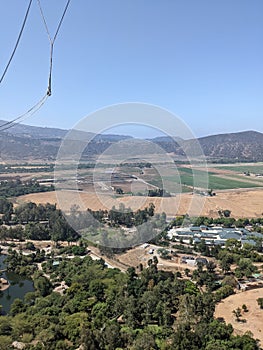 Aerial View of a Small Town, Farm Fields, Hills, and Trees