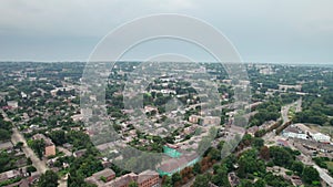 Aerial View of a Small Town, Urban landscape, Flying by Houses near Green Spaces