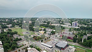 Aerial View of a Small Town, Urban landscape, Flying by Houses near Green Spaces