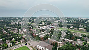 Aerial View of a Small Town, Urban landscape, Flying by Houses near Green Spaces