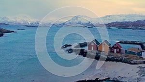 Aerial view of small traditional rorbu huts on winter Sommaroy island, Norway