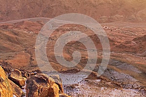 Aerial view of small village at the foot of Mount Sinai Mount Horeb, Gabal Musa, Moses Mount during sunrise. Sinai Peninsula