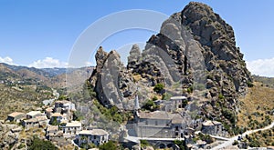 Aerial view of the Small village of Pentedattilo, church and ruins of the abandoned village, Greek colony on Mount Calvario, whose